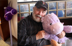 Robert teasing Angela with a purple hippo